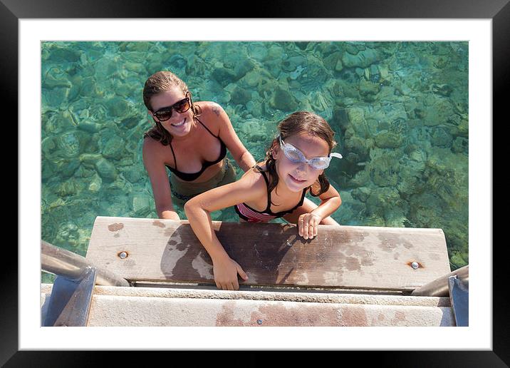 Mum and daughter in the sea Framed Mounted Print by Gail Johnson