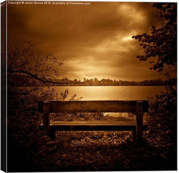   A lone bench in Ellesmere, Shropshire Canvas Print by Julian Bound