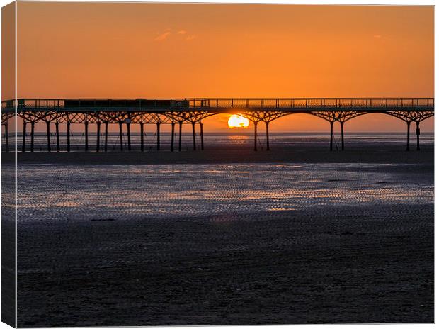 Pier at sunset Canvas Print by Victor Burnside