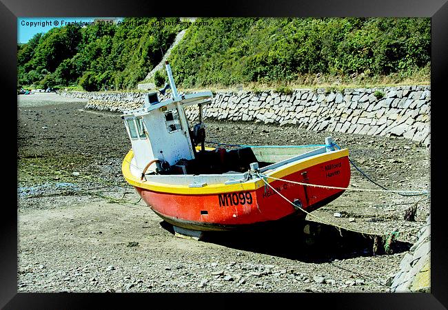 Fishing boat lies at anchor Framed Print by Frank Irwin