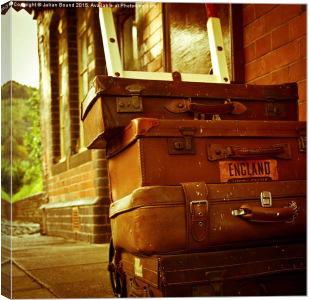  Old fashioned luggage on a train station in Llang Canvas Print by Julian Bound