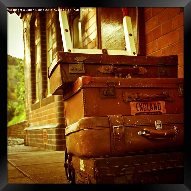  Old fashioned luggage on a train station in Llang Framed Print by Julian Bound