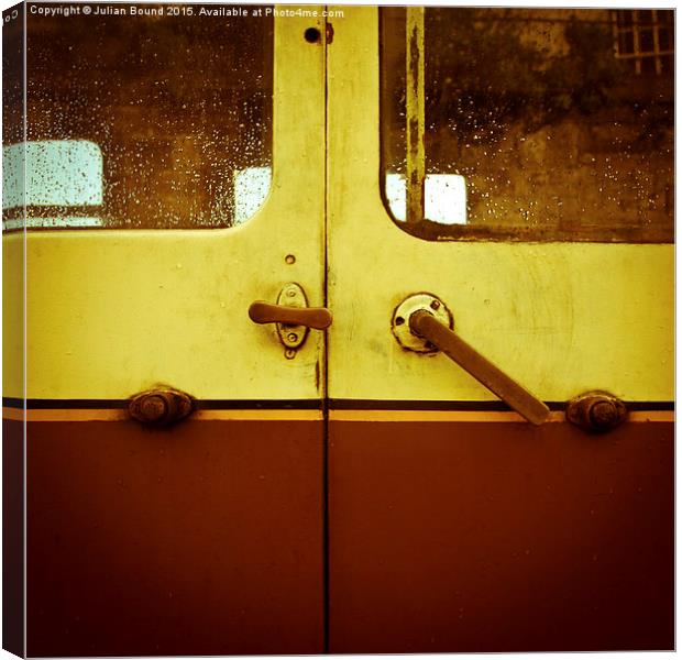 Train carriage doors on a train station in Llangol Canvas Print by Julian Bound