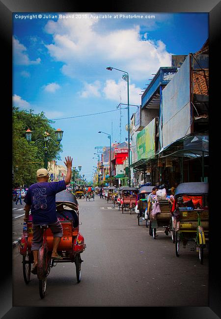 Rickshaw driver of Yogyakarta, Indonesia Framed Print by Julian Bound