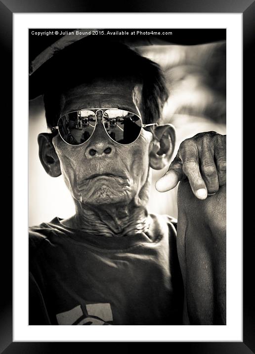 Man in sunglasses in Yogyakarta, Indonesia Framed Mounted Print by Julian Bound
