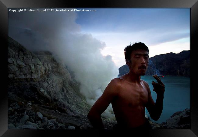 Sulphur miner of Ijen volcano, Java, Indonesia Framed Print by Julian Bound