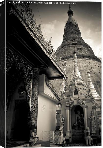 Shwedagon Pagoda and nun, Yangon, Mynamar Canvas Print by Julian Bound