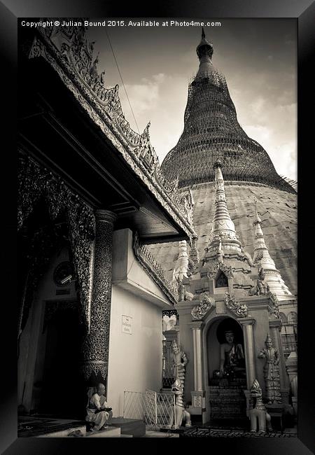 Shwedagon Pagoda and nun, Yangon, Mynamar Framed Print by Julian Bound