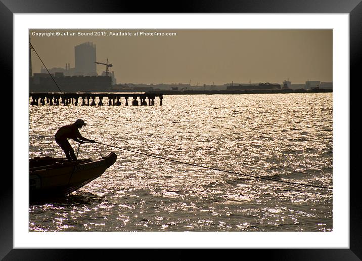 Boat and sailor, the marina of Jakarta, Indonesia Framed Mounted Print by Julian Bound