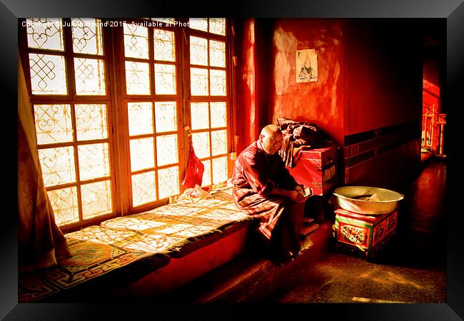 Elederly Tibetan Buddhist monk of Lhasa, Tibet Framed Print by Julian Bound