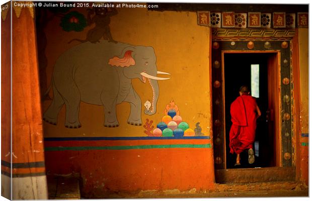  Novice monk, Paro, Bhutan Canvas Print by Julian Bound
