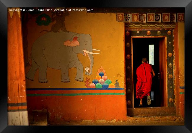  Novice monk, Paro, Bhutan Framed Print by Julian Bound