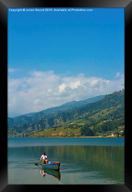A boat on Phewa Lake, Pokhara, Nepal Framed Print by Julian Bound