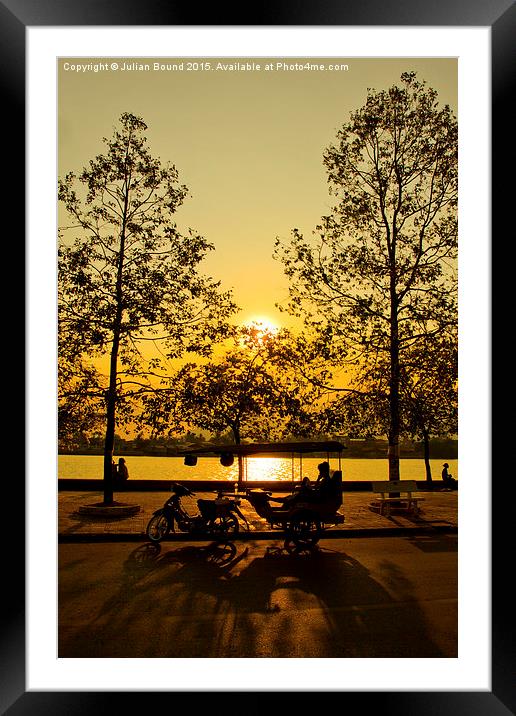 Sunset and Tuk Tuk driver of Kampot, Cambodia Framed Mounted Print by Julian Bound