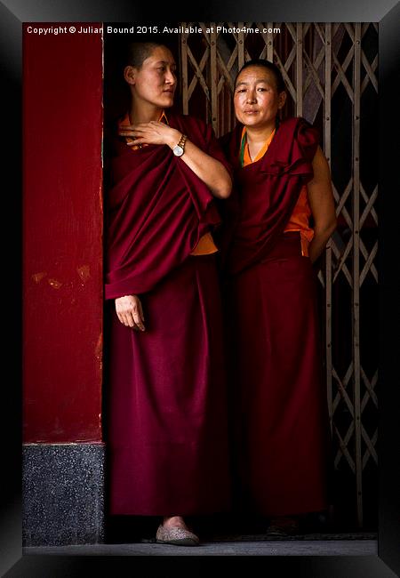 Tibetan Buddhist nuns of Kathmandu, Nepal Framed Print by Julian Bound