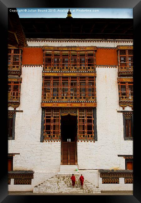 Two monks of Tashi Chho Dzong Fortress, Bhutan Framed Print by Julian Bound