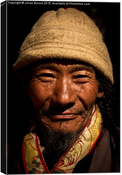  Tibet man, Lhasa, Tibet Canvas Print by Julian Bound