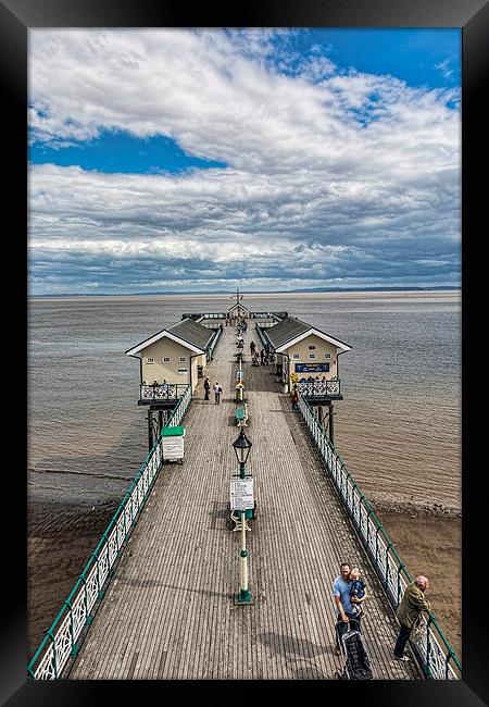 Looking Down The Pier 2 Framed Print by Steve Purnell