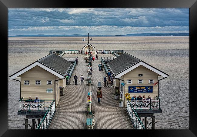 Looking Down The Pier 4 Framed Print by Steve Purnell