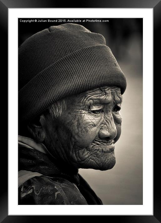 Elderly Tibetan lady, Boudhanath Temple, Kathmandu Framed Mounted Print by Julian Bound