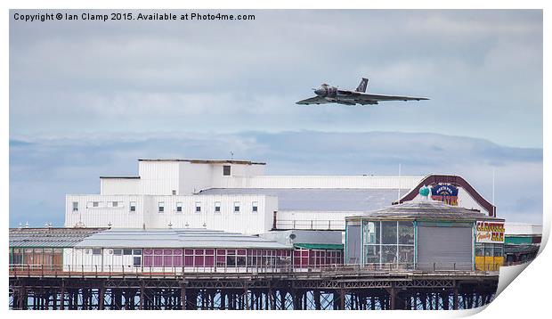  Vulcan over the pier Print by Ian Clamp