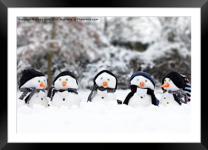 Cute snowman group in snow  Framed Mounted Print by Simon Bratt LRPS