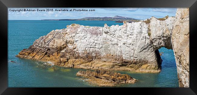 Rhoscolyn Arch Anglesey Framed Print by Adrian Evans