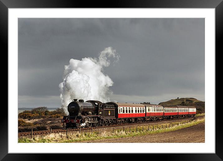 Steam train under storm clouds by the Coast Framed Mounted Print by Ian Duffield