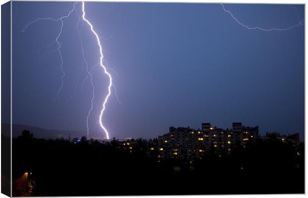 Lightning over residential area of Ljubljana , Slo Canvas Print by Ian Middleton