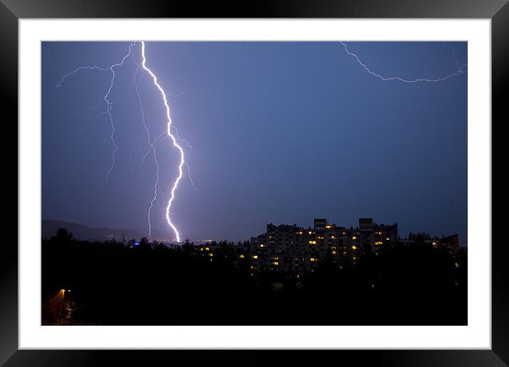 Lightning over residential area of Ljubljana , Slo Framed Mounted Print by Ian Middleton