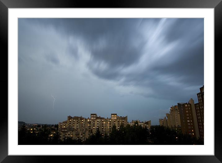 Storm clouds gathering over northern suburb of Lju Framed Mounted Print by Ian Middleton