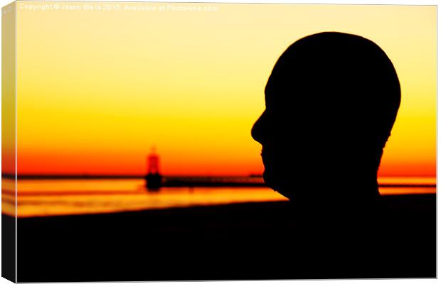 Silhouette of an Iron Man at sunset  Canvas Print by Jason Wells
