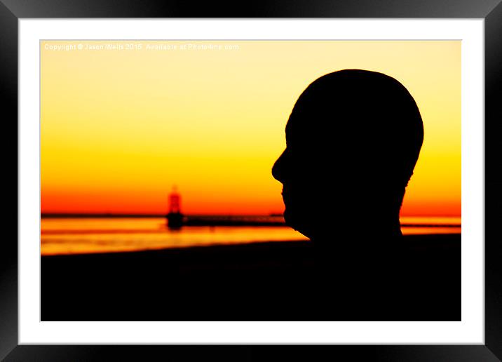 Silhouette of an Iron Man at sunset  Framed Mounted Print by Jason Wells