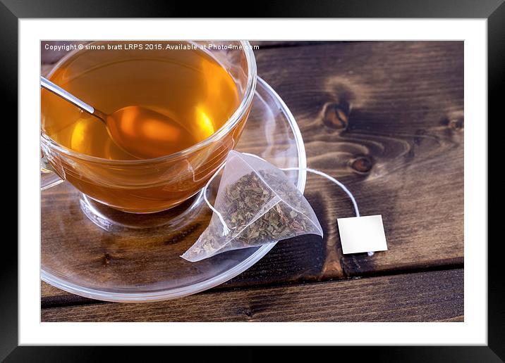 Green tea in glass teacup Framed Mounted Print by Simon Bratt LRPS