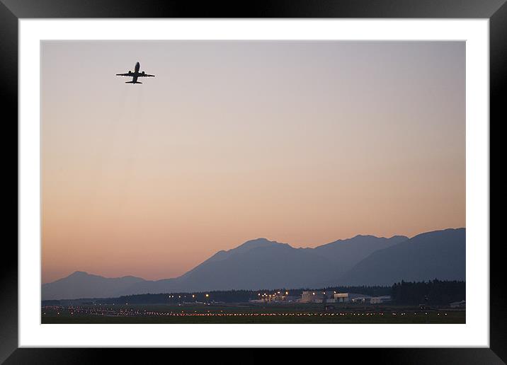 Aircraft taking off at dusk Framed Mounted Print by Ian Middleton