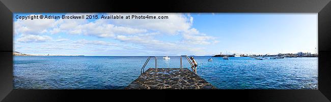 Steps to sea in Playa Blanca Panarama Framed Print by Adrian Brockwell