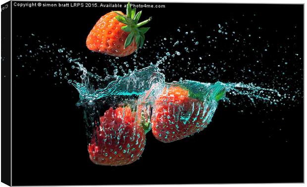 Strawberries splashed into water Canvas Print by Simon Bratt LRPS