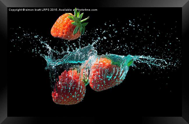 Strawberries splashed into water Framed Print by Simon Bratt LRPS