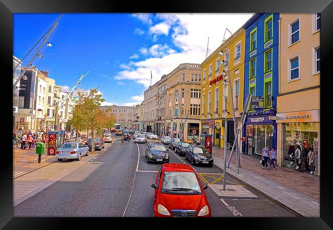  A high street in Cork City Ireland Framed Print by Sue Bottomley