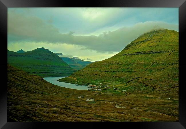  Mountains and small village in the Faroe Islands Framed Print by Sue Bottomley