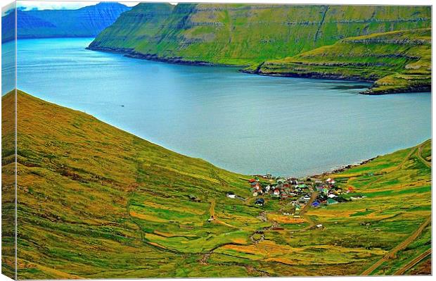  Mountains and small village in the Faroe Islands Canvas Print by Sue Bottomley