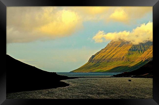 Leaving the Faroe Islands by sea  Framed Print by Sue Bottomley