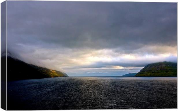 Leaving the Faroe Islands by Sea  Canvas Print by Sue Bottomley