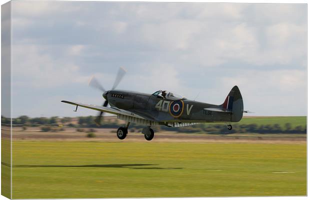 Spitfire TE311Grass Landing Canvas Print by J Biggadike