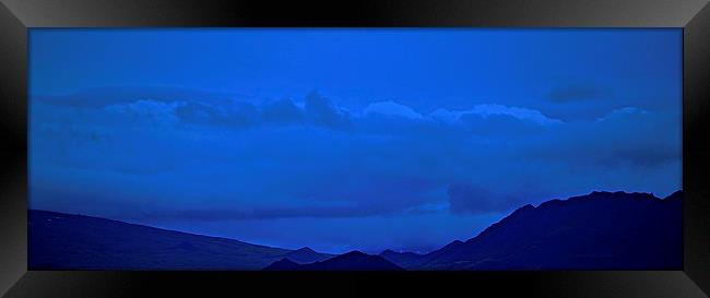  Blue skies over Silhouetted Mountains in Iceland Framed Print by Sue Bottomley