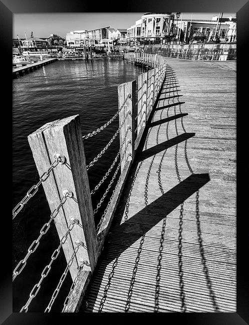  Cardiff Bay shadows on the boardwalk Framed Print by Andrew Richards