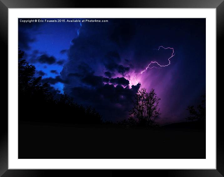 purple lightning between clouds Framed Mounted Print by Eric Fouwels