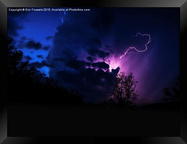purple lightning between clouds Framed Print by Eric Fouwels