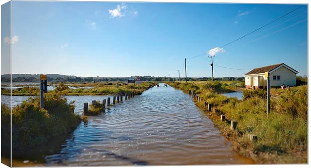 Kayaking down the road from the beach - Brancaster Canvas Print by Gary Pearson