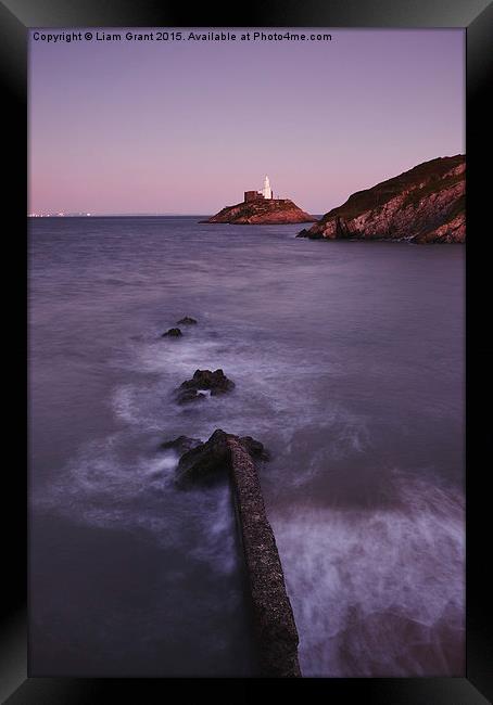 Lighthouse at dusk. Mumbles, Wales, UK. Framed Print by Liam Grant